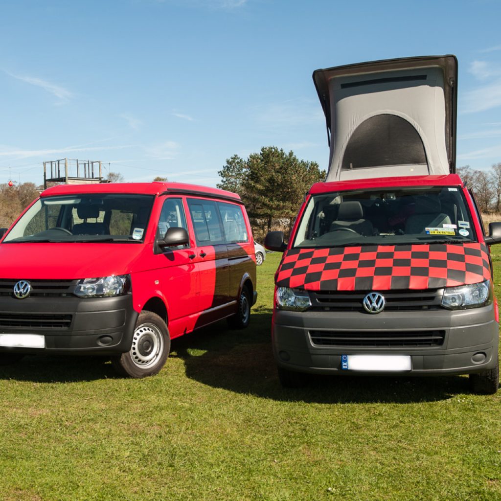 two red campervans