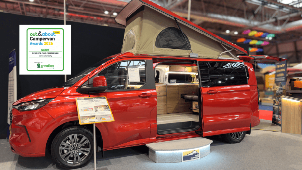 VW T7 Cromarty campervan at the NEC with winner best pop top campervan badge.