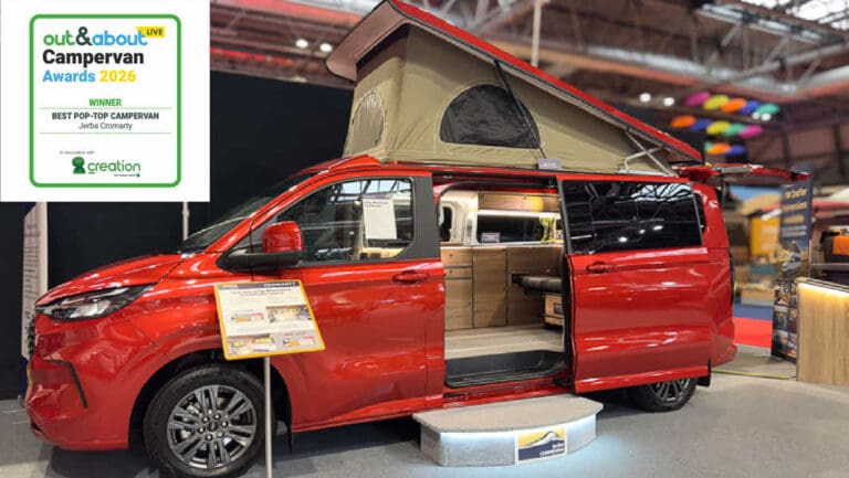 VW T7 Cromarty campervan at the NEC with winner best pop top campervan badge.