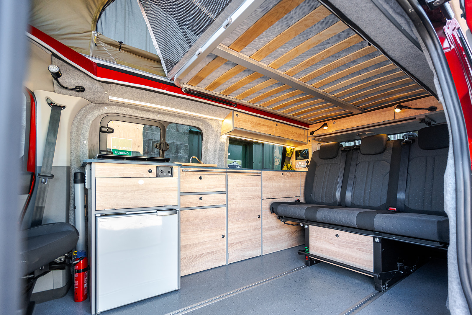 Roof Bed of a Red 2026 Ford Transit Custom Campervan Jerba Cromarty, 5000 Miles.