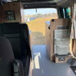 The Aisle of a Dark Blue 2022 VW Transporter T6.1 Jerba Campervan, 22,500 miles.