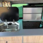 Kitchen of a Dark Blue 2022 VW Transporter T6.1 Jerba Campervan, 22,500 miles.