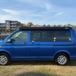 Nearside of a Dark Blue 2022 VW Transporter T6.1 Jerba Campervan, 22,500 miles.