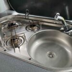 Burner hob of Grey VW Transporter T5 2008, Jerba Campervans Cromarty, 87,000 miles.