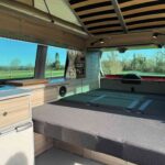 Rear bed of a Red 2023 VW T6.1 Transporter Jerba Campervans Tiree Conversion.