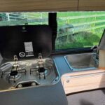 Kitchen of a Red 2023 VW T6.1 Transporter Jerba Campervans Tiree Conversion.