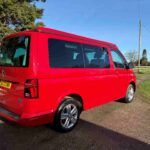 Rearside view of a Red 2023 VW T6.1 Transporter Jerba Campervans Tiree Conversion.