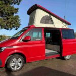 Side view of a Red 2023 VW T6.1 Transporter Jerba Campervans Tiree Conversion.