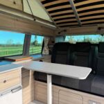 Table in a Red 2023 VW T6.1 Transporter Jerba Campervans Tiree Conversion.