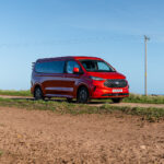 Front Angle of a Red 2026 Ford Transit Custom Campervan Jerba Cromarty, 5000 Miles.