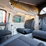 Rear Seats of a Red 2026 Ford Transit Custom Campervan, Jerba Sanna, 1000 Miles.