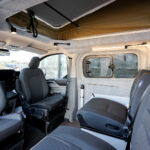 Front Seats of a Red 2026 Ford Transit Custom Campervan, Jerba Sanna, 1000 Miles.