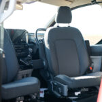 Front Seats of a Red 2026 Ford Transit Custom Campervan Jerba Cromarty, 5000 Miles.