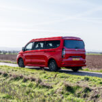 Rear Side of a Red 2026 Ford Transit Custom Campervan, Jerba Sanna, 1000 Miles.