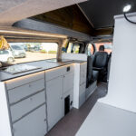 Kitchen Area of a Red 2026 Ford Transit Custom Campervan, Jerba Sanna, 1000 Miles.