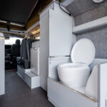 Rear Toilet of a Red 2026 Ford Transit Custom Campervan, Jerba Sanna, 1000 Miles.