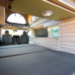 Rear Bed of a White 2026 Ford Transit Custom Campervan Jerba Tiree, 5000 Miles.