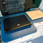 The Kitchen of a Red 2026 Ford Transit Custom Campervan Jerba Cromarty, 5000 Miles.