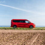 The Side of a Red 2026 Ford Transit Custom Campervan, Jerba Sanna, 1000 Miles.