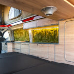 Rear Storage of a Red 2026 Ford Transit Custom Campervan Jerba Cromarty, 5000 Miles.