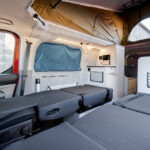 Sleeping Area of a Red 2026 Ford Transit Custom Campervan, Jerba Sanna, 1000 Miles.