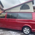 Elevating roof of a Red VW Transporter T6.1 Campervan Jerba Sanna, 19,000 miles.