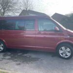 Offside View of a Red VW Transporter T6.1 Campervan Jerba Sanna, 19,000 miles.