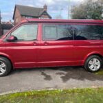 Side View of a Red VW Transporter T6.1 Campervan Jerba Sanna, 19,000 miles.