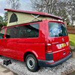 Nearside of a Red 2020 VW Transporter T6 Campervan Jerba Cromarty, 17,000 Miles.