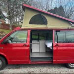 Side of a Red 2020 VW Transporter T6 Campervan Jerba Cromarty, 17,000 Miles.