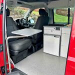 Front Seats of a Red 2020 VW Transporter T6 Campervan Jerba Cromarty, 17,000 Miles.