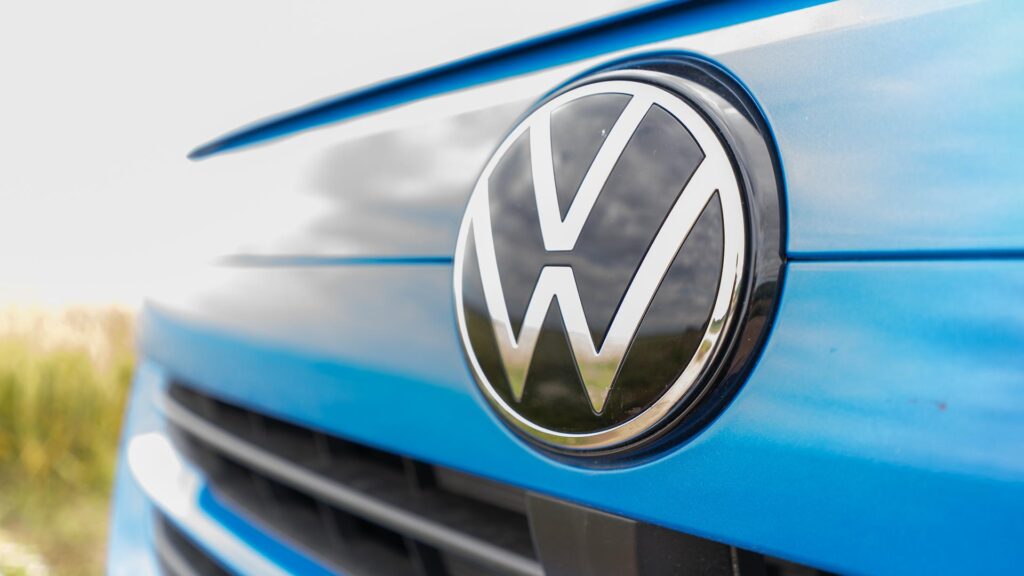 A close up of the front badge of a new Volkswagen Transporter T7 van.