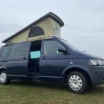 Front Side View of a Blue VW Transporter T5 2011 Campervan Conversion, 94000 miles.