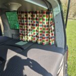 Curtains of a Blue VW Transporter T5 2011 Campervan Conversion, 94000 miles.