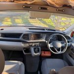Front Seats of an Orange 2021 VW Transporter T6.1 Tiree Campervan, 66000 Miles.