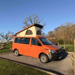 Side View of an Orange 2021 VW Transporter T6.1 Tiree Campervan, 66000 Miles.