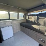 Rear Seats of an Orange 2021 VW Transporter T6.1 Tiree Campervan, 66000 Miles.