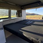 Rear Bed of an Orange 2021 VW Transporter T6.1 Tiree Campervan, 66000 Miles.