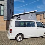Elevating Roof of a White 2012 VW Transporter T5 SWB Tiree Campervan, 46,000 Miles.