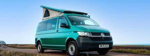 Side View of a Green VW Transporter T6.1 Campervan Sanna Layout, on a UK Road.